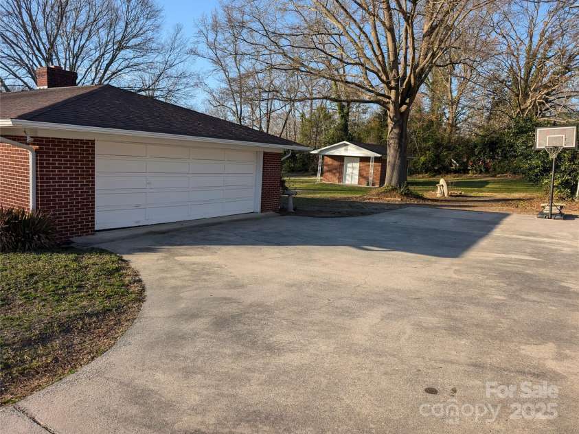 1807 Brantley Road, Kannapolis, NC 28083.  MLS# CAR4221445, YatesRealty ID 10470. Exterior Dbl Garage & Parking Pad