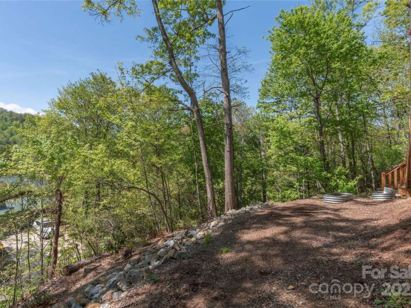 186 Timucua Trail, Waynesville, NC 28786.  MLS# CAR4254132, YatesRealty ID 10475. Area below deck.