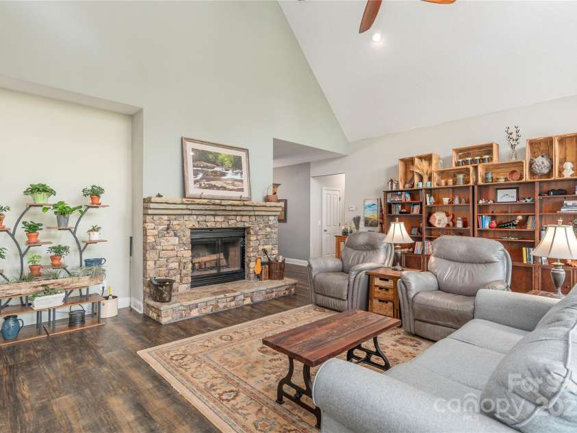 186 Timucua Trail, Waynesville, NC 28786.  MLS# CAR4254132, YatesRealty ID 10475. Gather around the fireplace.