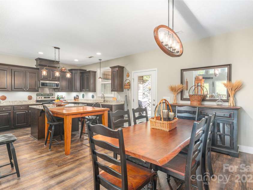 186 Timucua Trail, Waynesville, NC 28786.  MLS# CAR4254132, YatesRealty ID 10475. Looking toward kitchen from dining area.