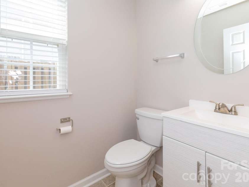30 Chesire Way, Fletcher, NC 28732.  MLS# CAR4363871, YatesRealty ID 10475. Downstairs Half Bath 