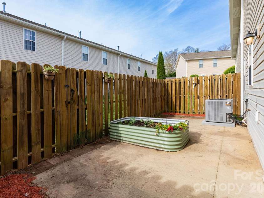 30 Chesire Way, Fletcher, NC 28732.  MLS# CAR4363871, YatesRealty ID 10475. Fenced back patio