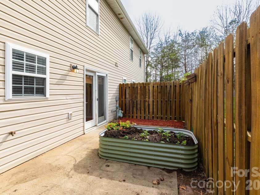 30 Chesire Way, Fletcher, NC 28732.  MLS# CAR4363871, YatesRealty ID 10475. Fenced back patio
