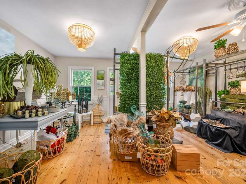 172 formerly 153 Main Street, Saluda, NC 28773.  MLS# CAR4225037, YatesRealty ID 1048. Great natural and artificial lighting and ceiling fan in front room.