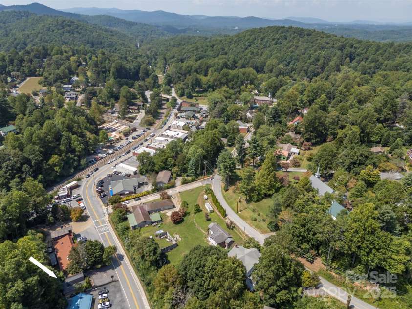 172 formerly 153 Main Street, Saluda, NC 28773.  MLS# CAR4225037, YatesRealty ID 1048. View of the building relative to historic Main St.