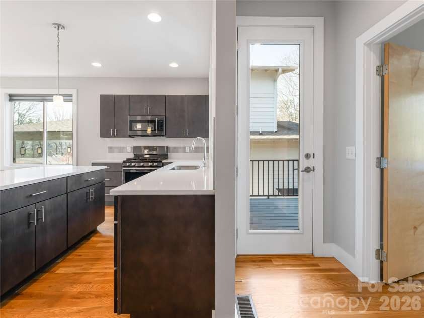 27 Mauricet Lane, Asheville, NC 28806.  MLS# CAR4321609, YatesRealty ID 10488. Easy access to back deck from kitchen