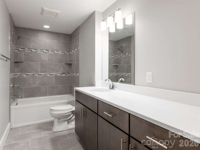 27 Mauricet Lane, Asheville, NC 28806.  MLS# CAR4321609, YatesRealty ID 10488. Lower level bathroom