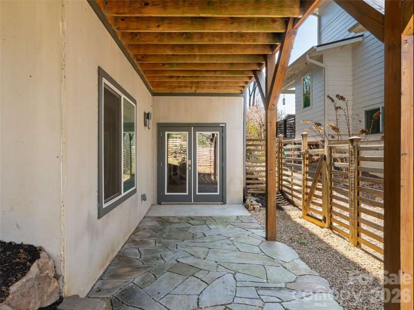 27 Mauricet Lane, Asheville, NC 28806.  MLS# CAR4321609, YatesRealty ID 10488. Lower level patio