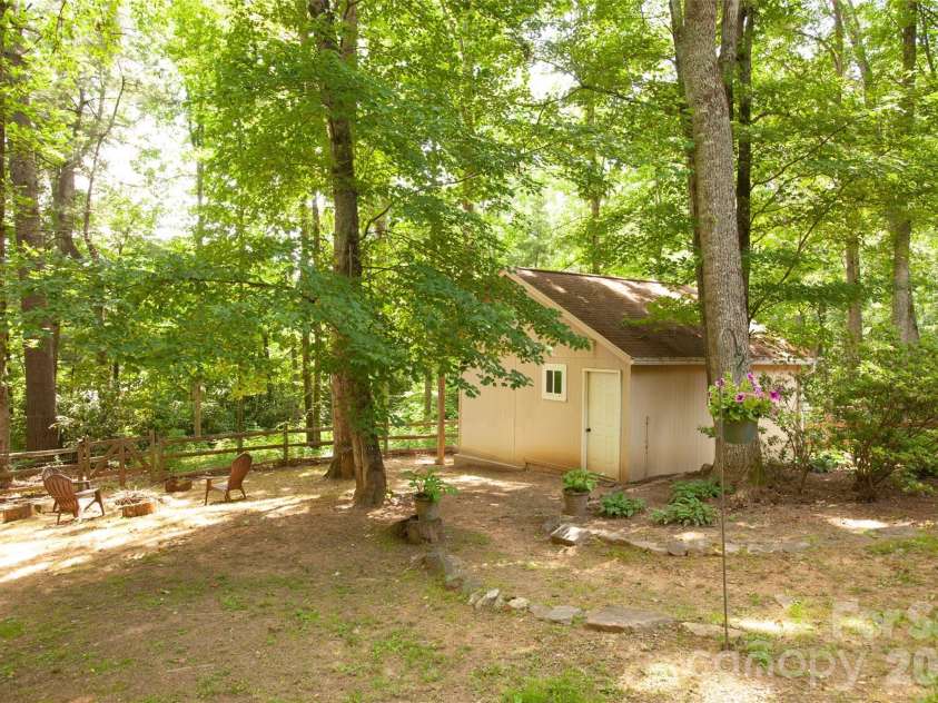 116 Vehorn Road, Fairview, NC 28730.  MLS# CAR4345277, YatesRealty ID 10496. Backyard with Firepit and Workshop/Shed