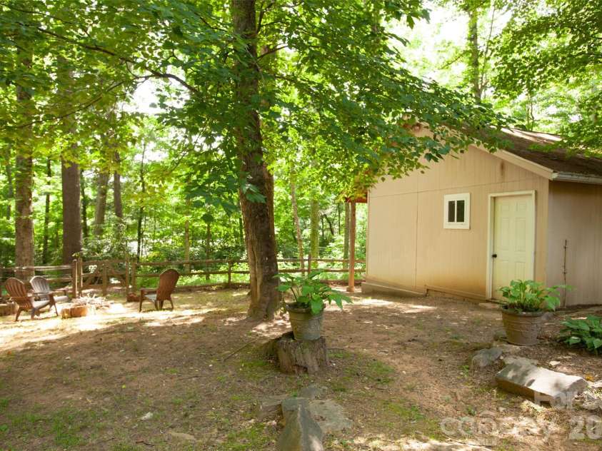 116 Vehorn Road, Fairview, NC 28730.  MLS# CAR4345277, YatesRealty ID 10496. Backyard with Firepit and Workshop/Shed