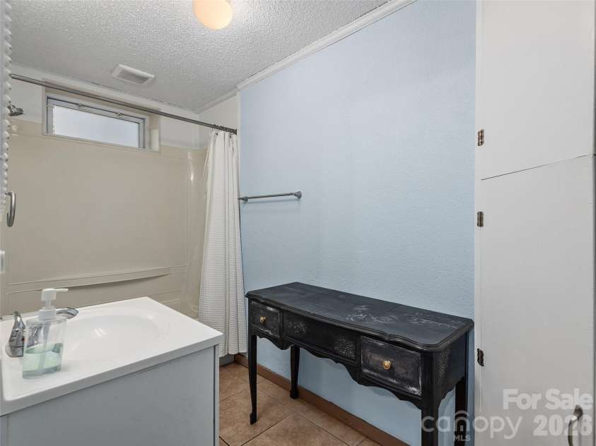116 Vehorn Road, Fairview, NC 28730.  MLS# CAR4345277, YatesRealty ID 10496. Lower Level Bathroom