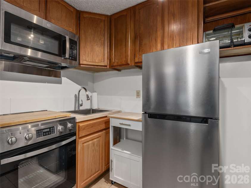 116 Vehorn Road, Fairview, NC 28730.  MLS# CAR4345277, YatesRealty ID 10496. Lower Level Kitchenette