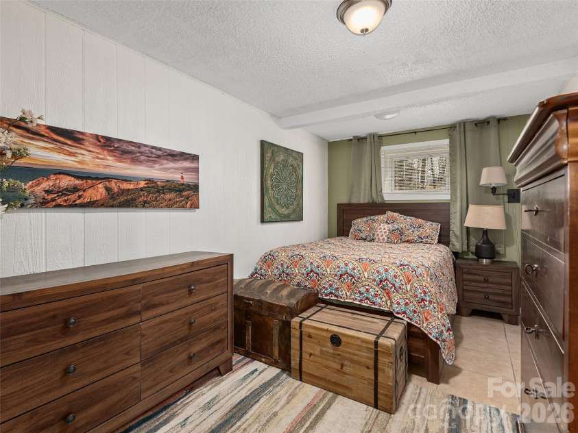 116 Vehorn Road, Fairview, NC 28730.  MLS# CAR4345277, YatesRealty ID 10496. Lower Level Sleeping Area