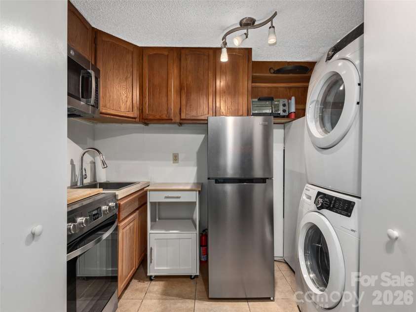 116 Vehorn Road, Fairview, NC 28730.  MLS# CAR4354116, YatesRealty ID 10496. Lower Unit Kitchenette & Washer/Dryer Unit