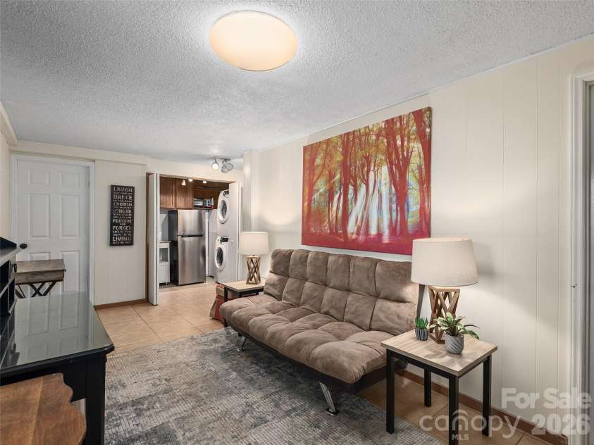 116 Vehorn Road, Fairview, NC 28730.  MLS# CAR4354116, YatesRealty ID 10496. Lower Unit Living Room