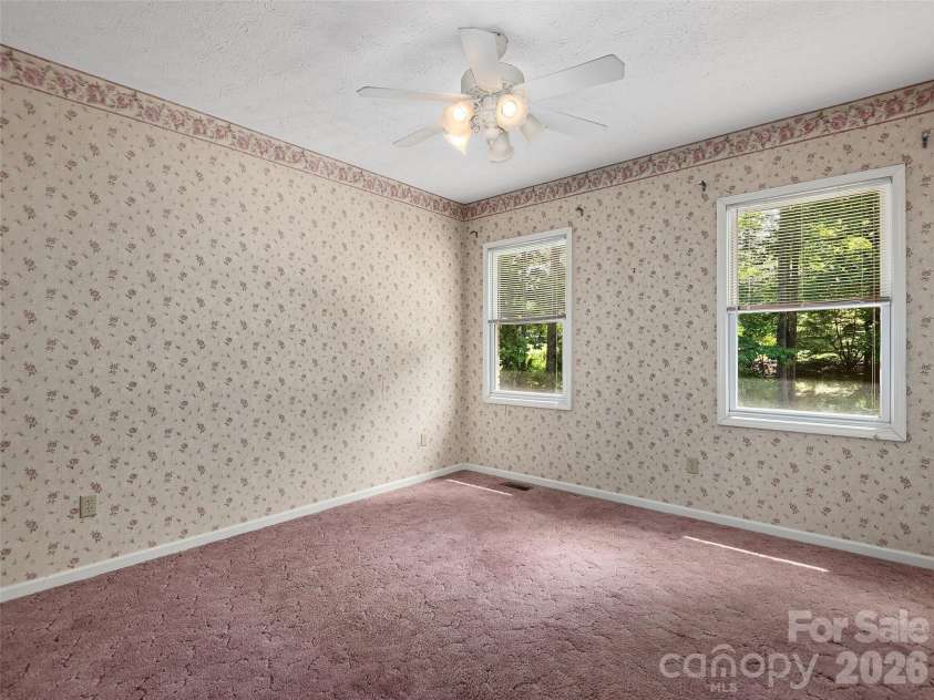 39 Beaumont Drive, Hendersonville, NC 28739.  MLS# CAR4385271, YatesRealty ID 10499. Guest Room one with en suite bath