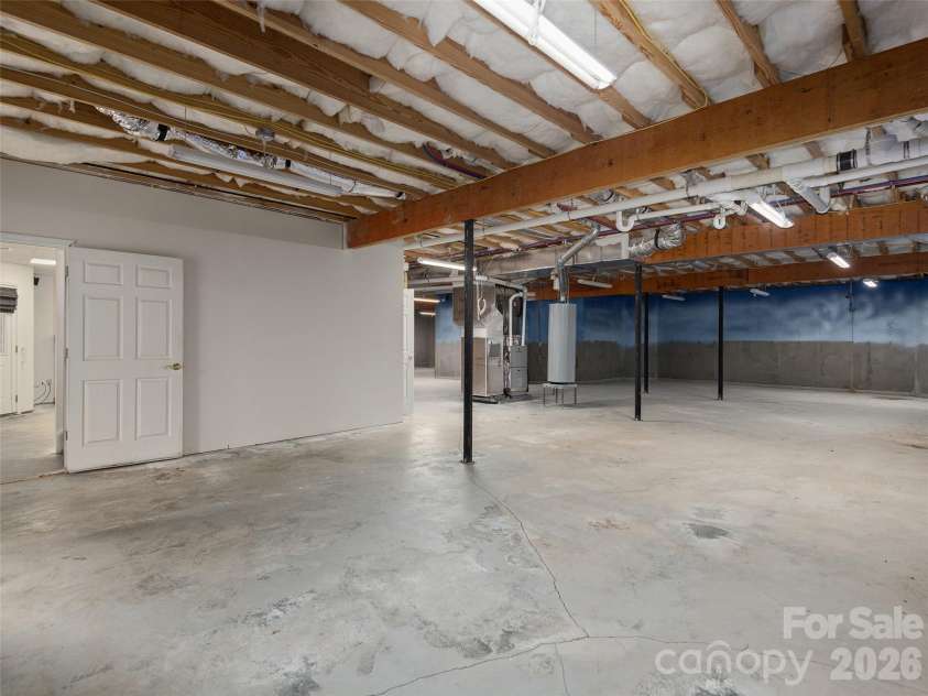 39 Beaumont Drive, Hendersonville, NC 28739.  MLS# CAR4385271, YatesRealty ID 10499. Huge unfinished basement with tons of possibilities