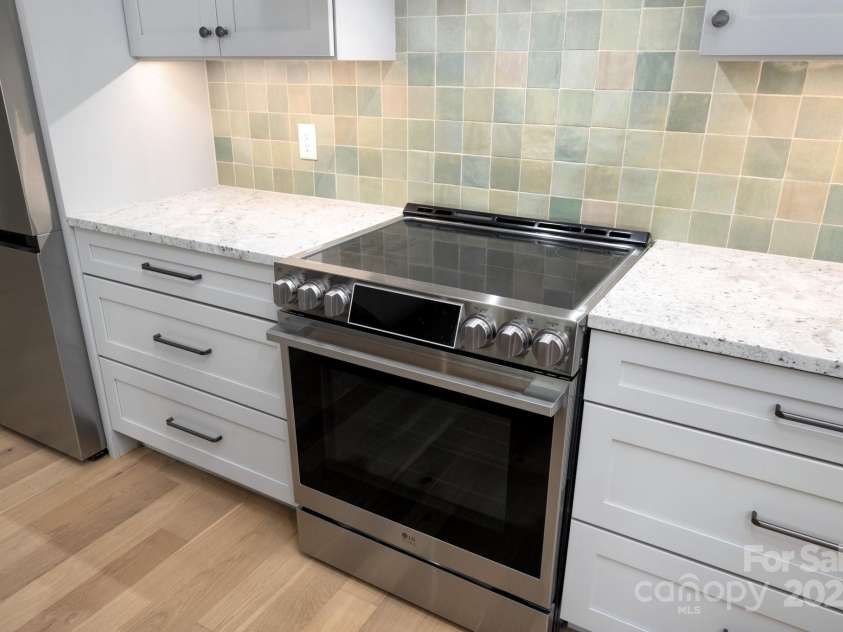 19 Beekeeper Trail, Swannanoa, NC 28778.  MLS# CAR4251601, YatesRealty ID 10506. Efficient Induction Cooktop