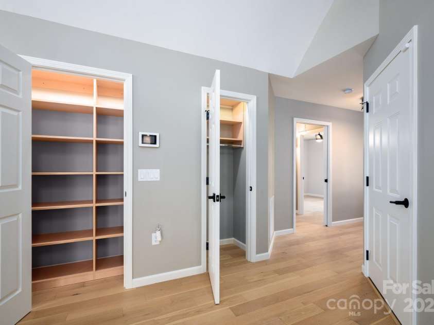 19 Beekeeper Trail, Swannanoa, NC 28778.  MLS# CAR4251601, YatesRealty ID 10506. Pantry with Built-In Organization and a Coat Closet at Entry