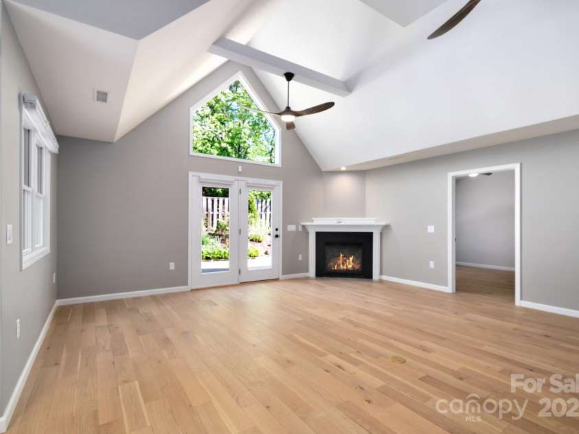 19 Beekeeper Trail, Swannanoa, NC 28778.  MLS# CAR4251601, YatesRealty ID 10506. Spacious Living Room with Vaulted Ceiling and Patio Access