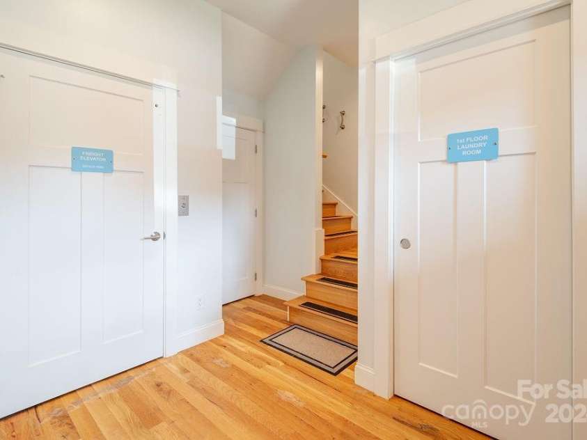 406 Kessler Place, Asheville, NC 28804.  MLS# CAR4172297, YatesRealty ID 1052. Interior Foyer w/ elevator.