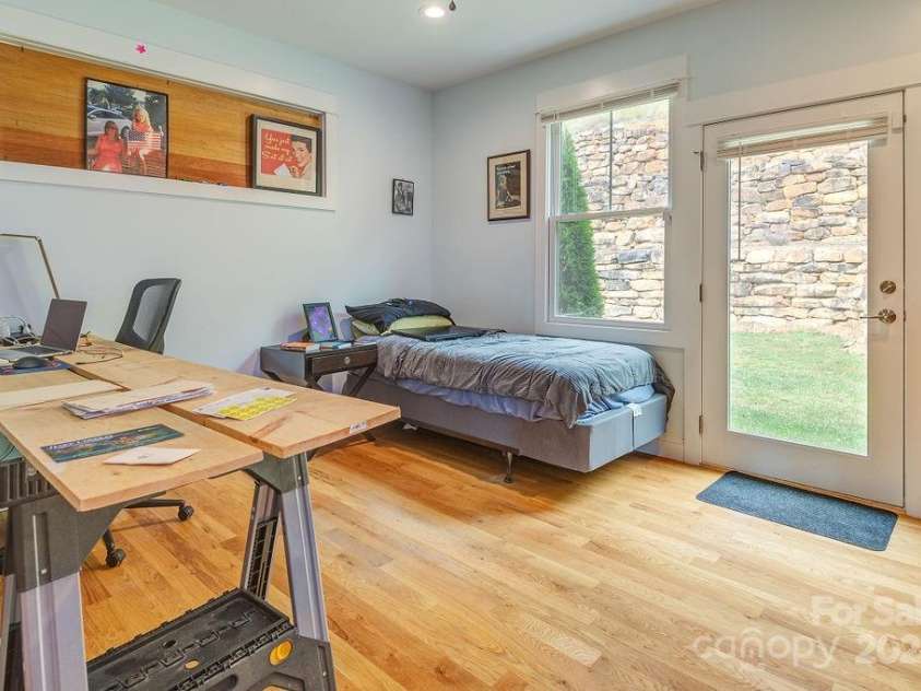 406 Kessler Place, Asheville, NC 28804.  MLS# CAR4172297, YatesRealty ID 1052. Second level en-suite bedroom with exterior access to backyard space.