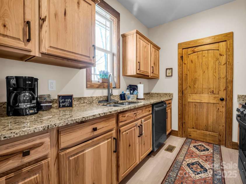 131 Pierpoint Drive, Lake Lure, NC 28746.  MLS# CAR4211806, YatesRealty ID 10522. Kitchen to laundry room
