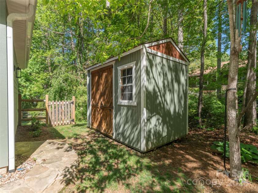 35 Mann Drive, Asheville, NC 28805.  MLS# CAR4252485, YatesRealty ID 10548. Additional storage building near the 2 car garage