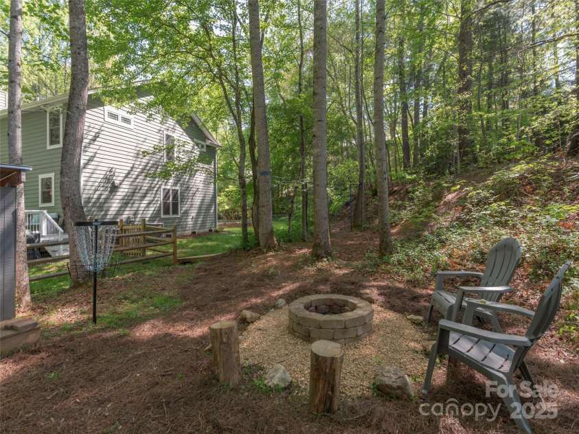 35 Mann Drive, Asheville, NC 28805.  MLS# CAR4252485, YatesRealty ID 10548. Another view - enjoy peaceful evenings at the fire pit!
