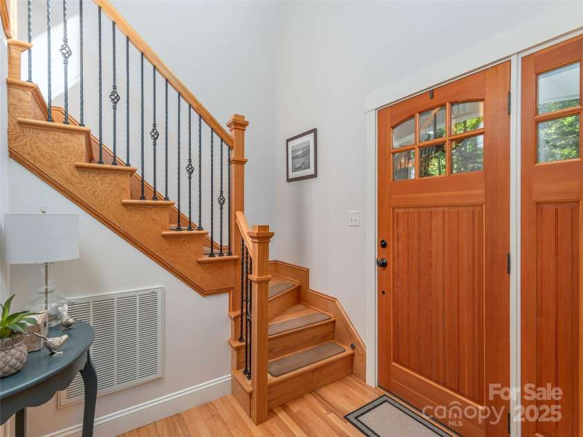 35 Mann Drive, Asheville, NC 28805.  MLS# CAR4252485, YatesRealty ID 10548. Beautiful entry door, foyer, and stairwell to the 2nd level