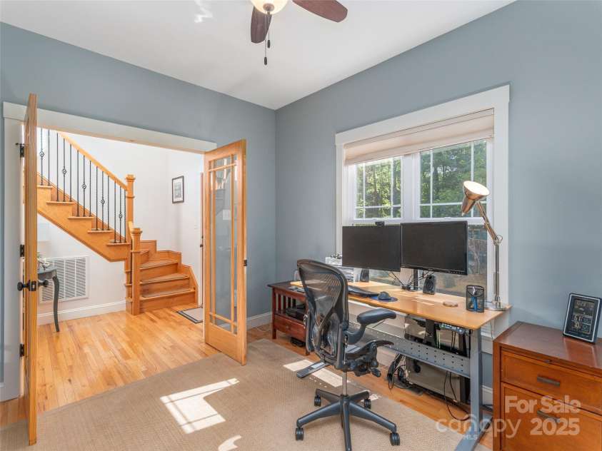35 Mann Drive, Asheville, NC 28805.  MLS# CAR4252485, YatesRealty ID 10548. Flex space currently serviing as a full office - leaded glass doors added by these homeowners