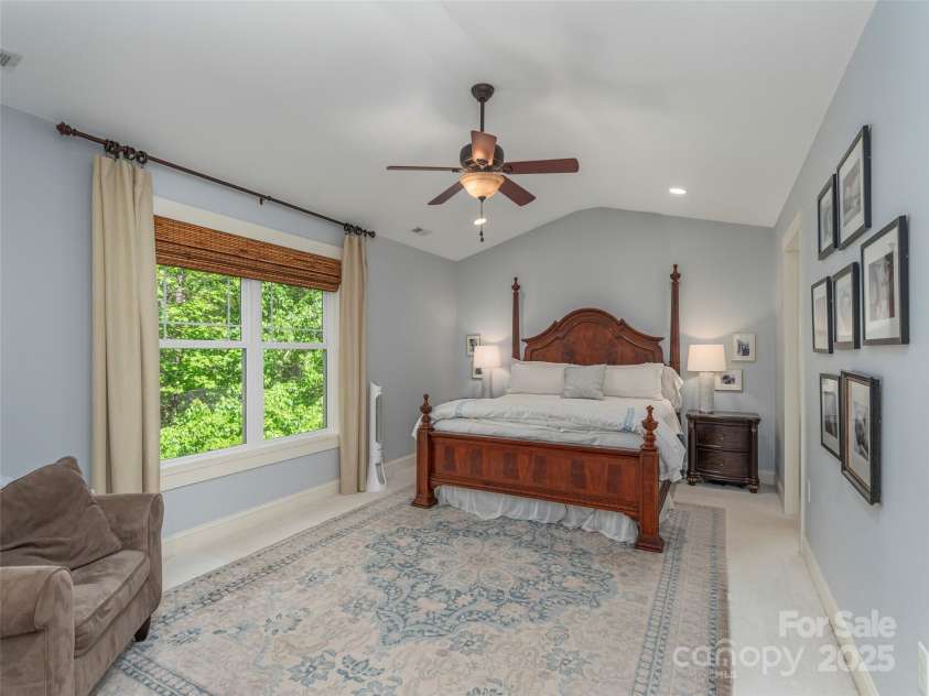 35 Mann Drive, Asheville, NC 28805.  MLS# CAR4252485, YatesRealty ID 10548. Primary bedroom with vaulted ceiling and plenty of natural light