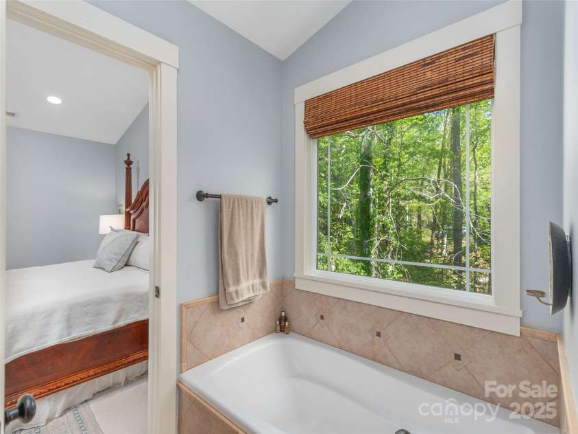 35 Mann Drive, Asheville, NC 28805.  MLS# CAR4252485, YatesRealty ID 10548. Soaker tub, updated window treatments, and plenty of natural light