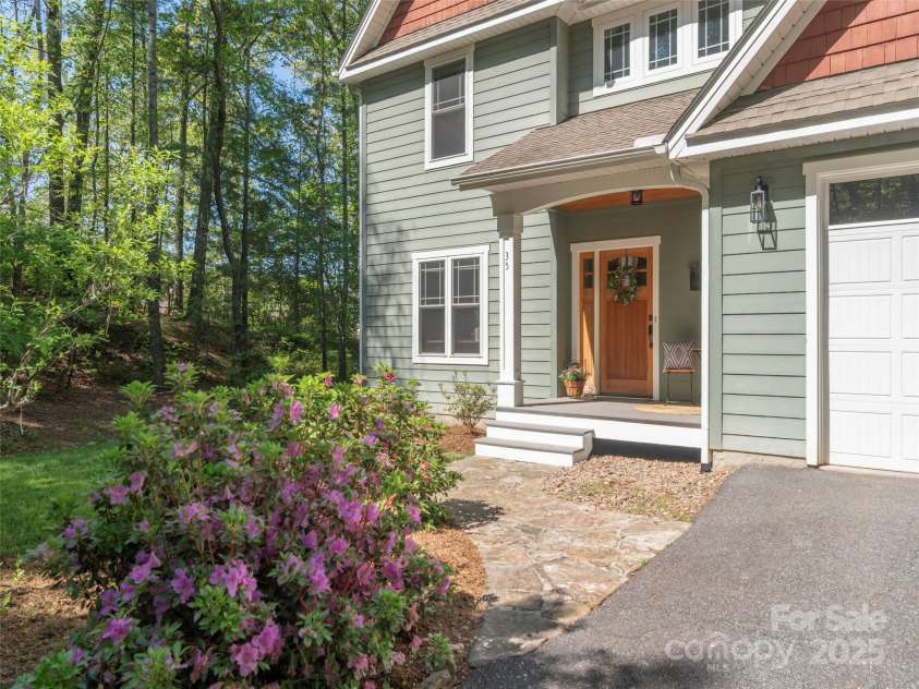 35 Mann Drive, Asheville, NC 28805.  MLS# CAR4252485, YatesRealty ID 10548. Wooded lot with perennials and annuals, a great setting