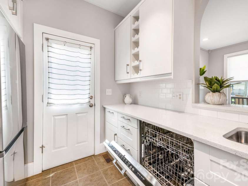 8 Lamar Avenue, Asheville, NC 28803.  MLS# CAR4365889, YatesRealty ID 10551. Dishwasher with matching cabinet panel
