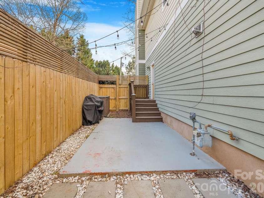 8 Lamar Avenue, Asheville, NC 28803.  MLS# CAR4365889, YatesRealty ID 10551. Patio off kitchen for outdoor cooking, fully fenced