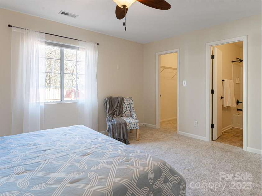 70 Wyatt Street, Asheville, NC 28803.  MLS# CAR4322963, YatesRealty ID 10553. Ensuite Guest Bedroom with full bath, large closet on Main Level