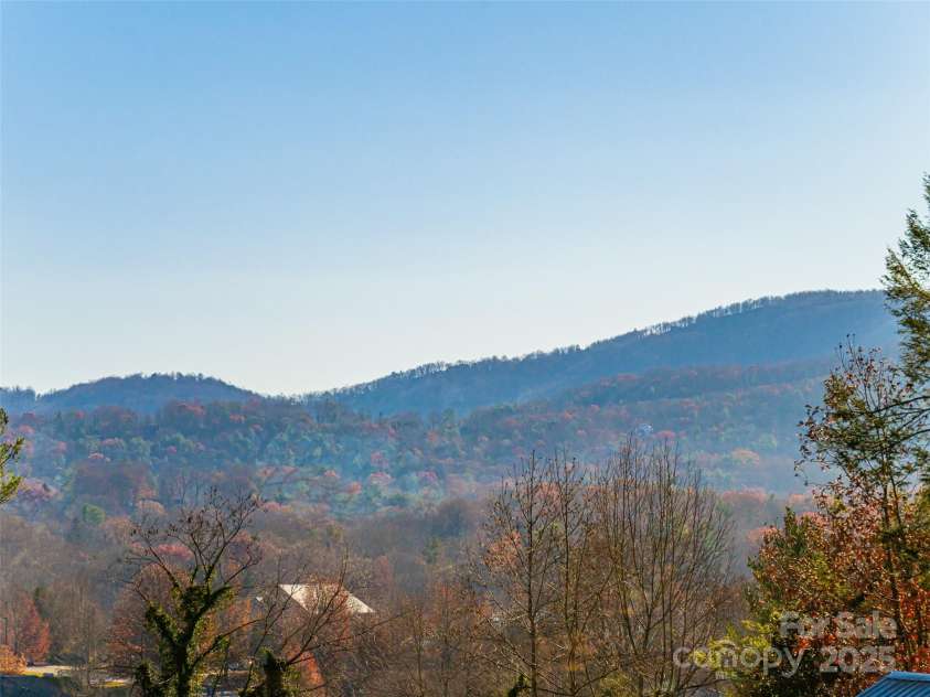 70 Wyatt Street, Asheville, NC 28803.  MLS# CAR4322963, YatesRealty ID 10553. Long range mountain views from Primary BR and deck