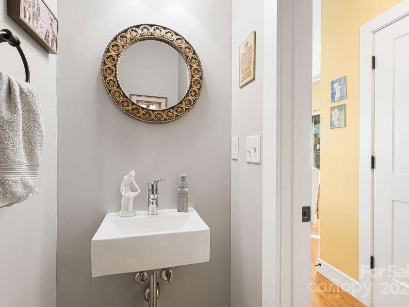 180 Moody Avenue, Candler, NC 28715.  MLS# CAR4248011, YatesRealty ID 10561. First Floor Half Bath