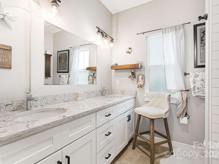 180 Moody Avenue, Candler, NC 28715.  MLS# CAR4248011, YatesRealty ID 10561. First Floor Primary Bath