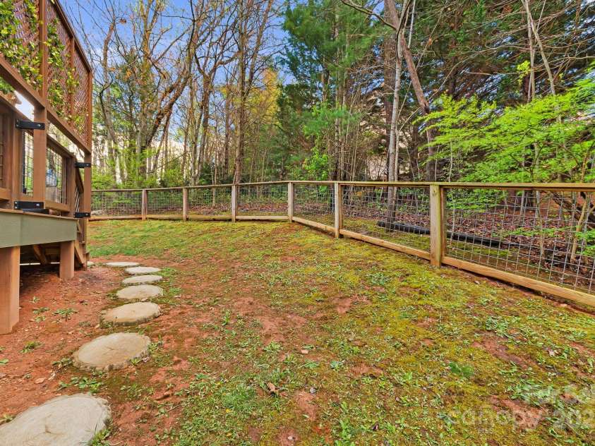 180 Moody Avenue, Candler, NC 28715.  MLS# CAR4248011, YatesRealty ID 10561. Side Yard