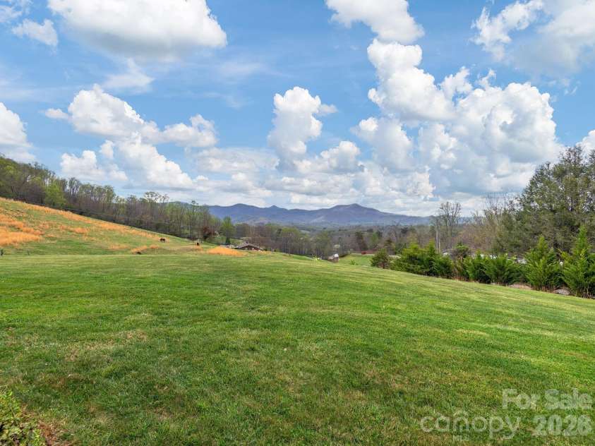 193 Youngs Cove Road, Candler, NC 28715.  MLS# CAR4363797, YatesRealty ID 10564. Large back yard