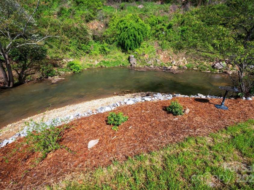 85 Laurel Cove Road, Candler, NC 28715.  MLS# CAR4251695, YatesRealty ID 10564. Beautiful South Hominy Creek