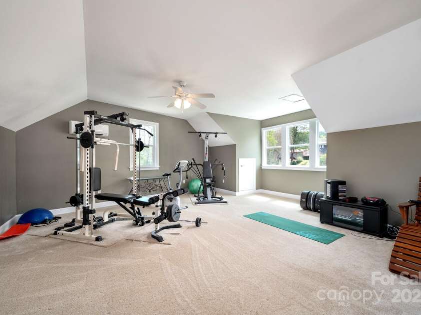 85 Laurel Cove Road, Candler, NC 28715.  MLS# CAR4251695, YatesRealty ID 10564. Fantastic and Versatile Space Over the Garage