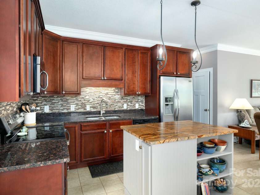 85 Laurel Cove Road, Candler, NC 28715.  MLS# CAR4251695, YatesRealty ID 10564. High End Finishes in the Primary Kitchen