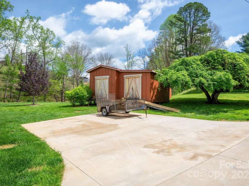 85 Laurel Cove Road, Candler, NC 28715.  MLS# CAR4251695, YatesRealty ID 10564. Huge 24x24 Workshop with Extra Storage Area