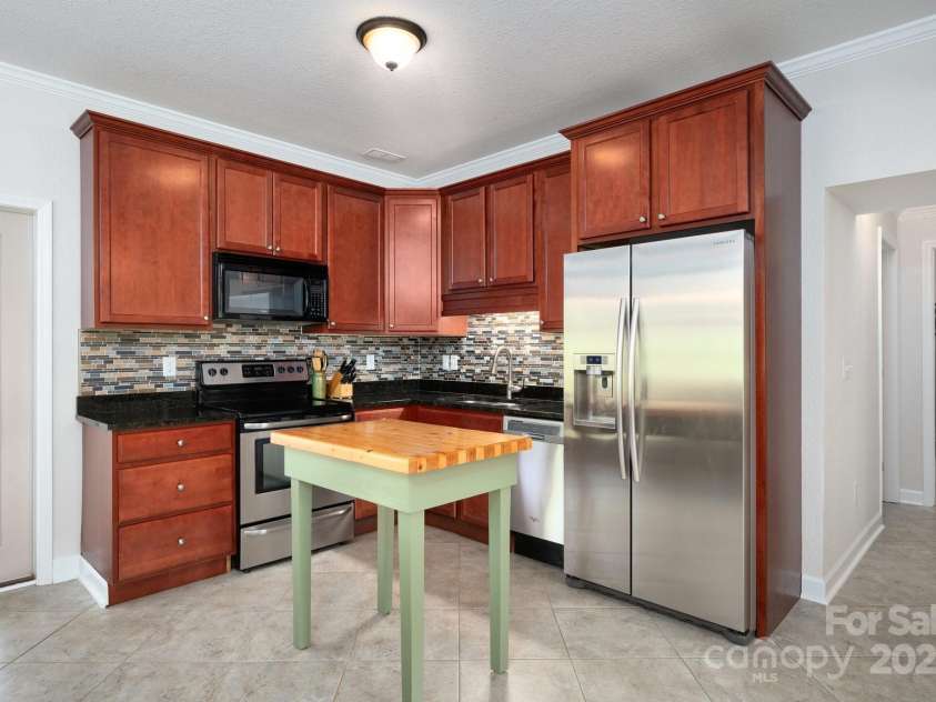 85 Laurel Cove Road, Candler, NC 28715.  MLS# CAR4251695, YatesRealty ID 10564. Main Level Kitchen in2nd Living Quarters