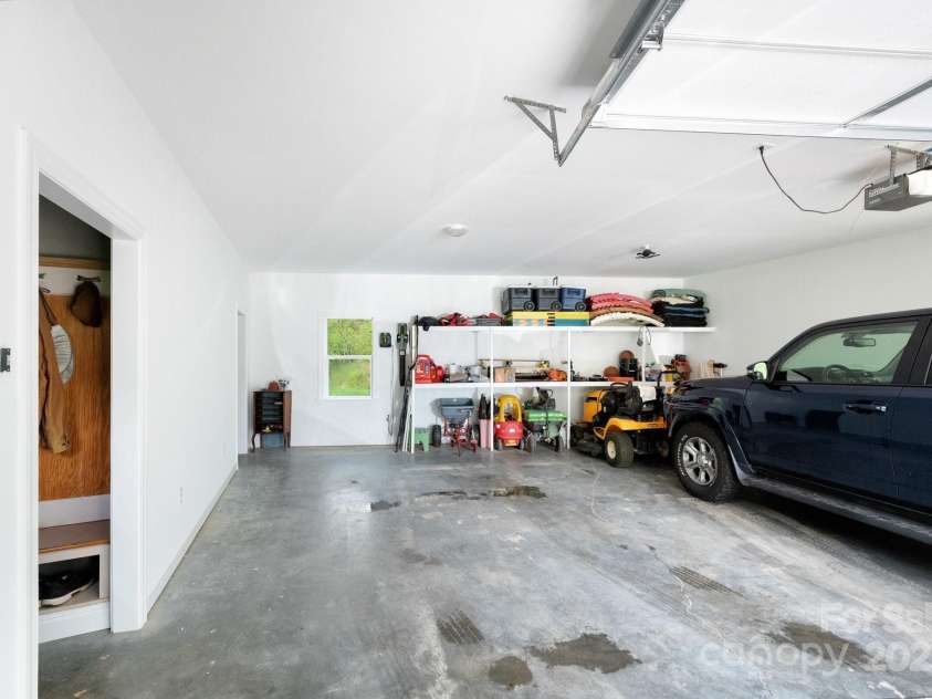 85 Laurel Cove Road, Candler, NC 28715.  MLS# CAR4251695, YatesRealty ID 10564. Oversized Two Car Garage