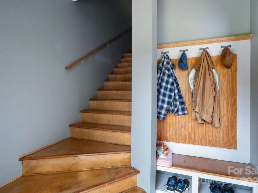 85 Laurel Cove Road, Candler, NC 28715.  MLS# CAR4251695, YatesRealty ID 10564. Stairs/Mudroom from Garage Entry Lead to Bonus Room Over Garage and Upstairs Deck Entry Door