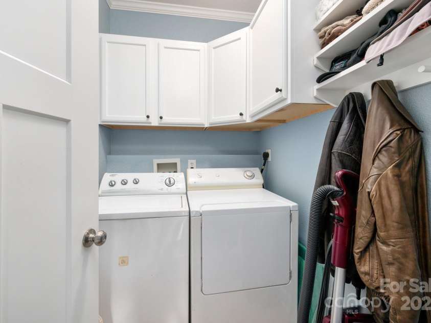 85 Laurel Cove Road, Candler, NC 28715.  MLS# CAR4251695, YatesRealty ID 10564. Upper Level Laundry Room